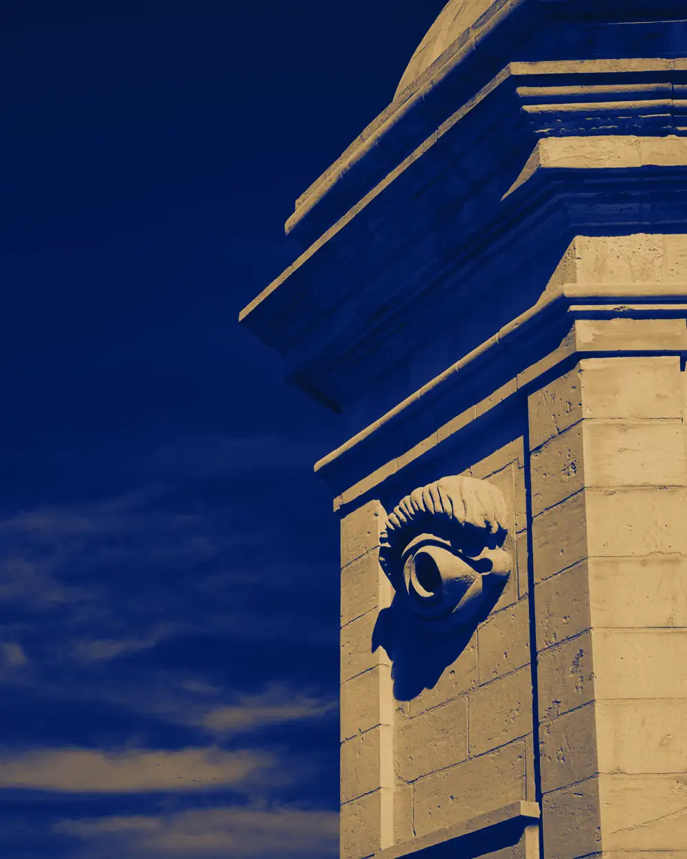 The carved stone eye of the Gardjola watchtower in Senglea, Malta, rendered in navy and gold